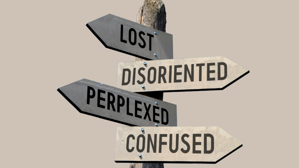 Wooden signpost with 4 arrows and words on them about Feeling Lost, blue sky in background